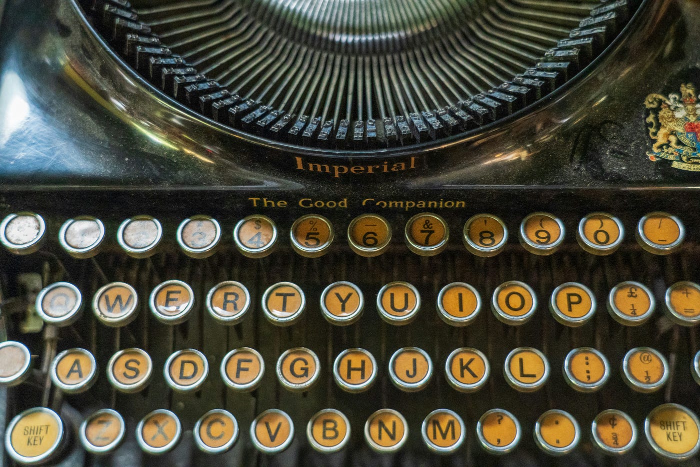 A zoomed-in keyboard of an antique typewriter.