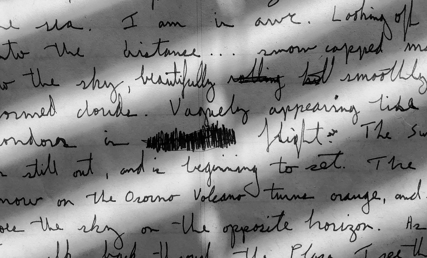 A photo of a paper with unintelligible handwritten notes on it.